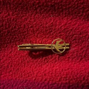 Gold Tie Bar with Circle Emblem